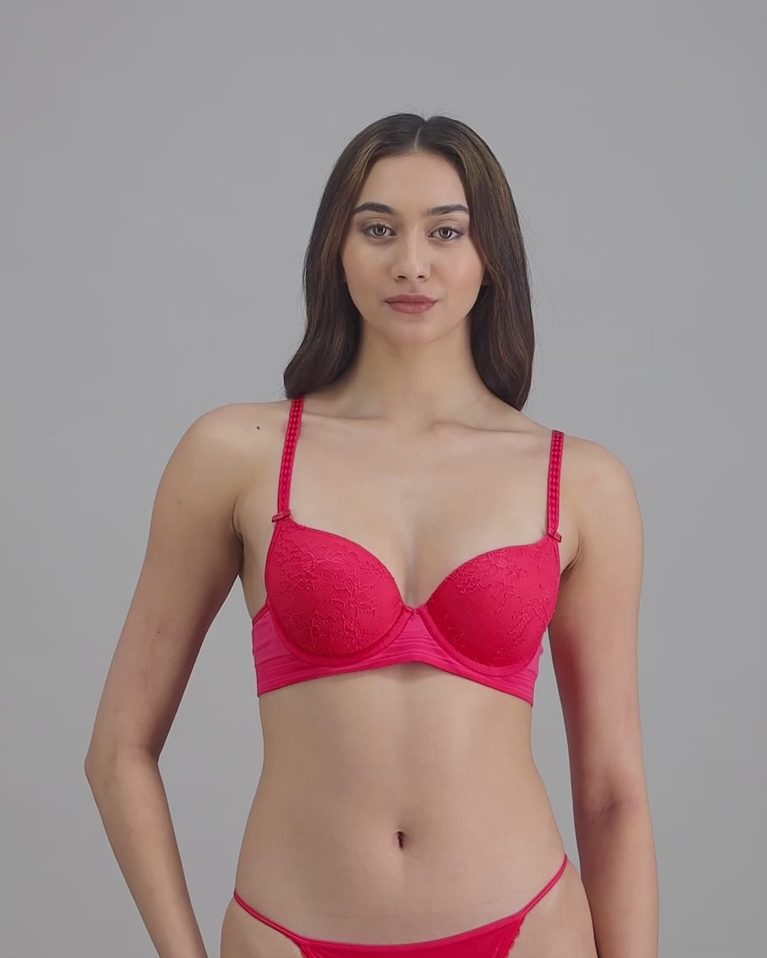 model-poses-in-red-bra-and-tanga