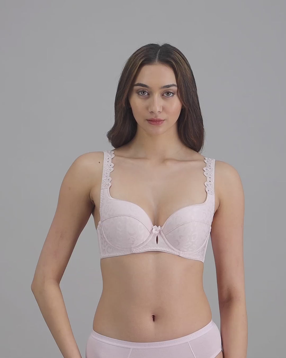 model-poses-in-pale-pink-bra-and-underwear