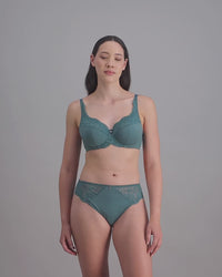 model-poses-in-blue-bra-and-underwear