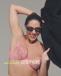 model-poses-in-pink-and-red-embroidered-lingerie